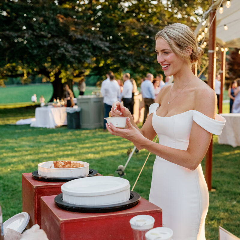 Bride at outdoor food table