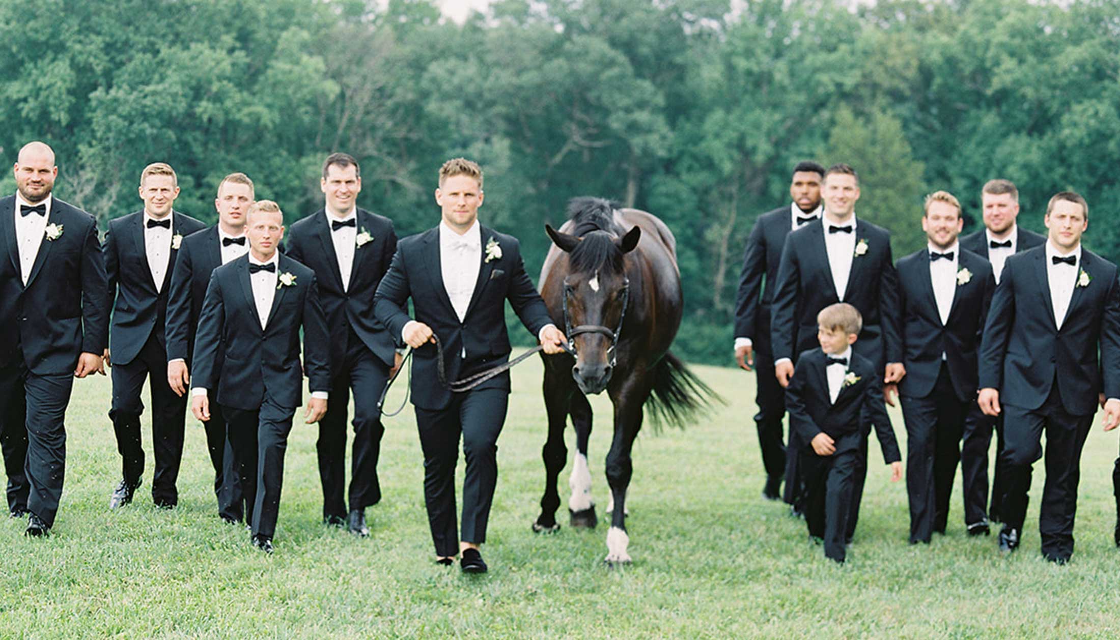 Groom and groomsmen with a horse