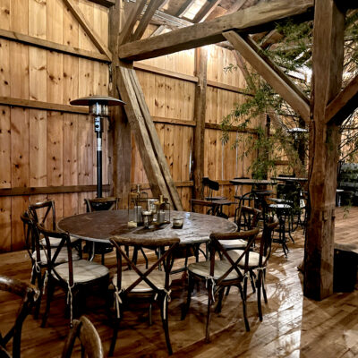 table and chairs set up for an event in the barn