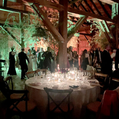 People dancing during an event in the barn